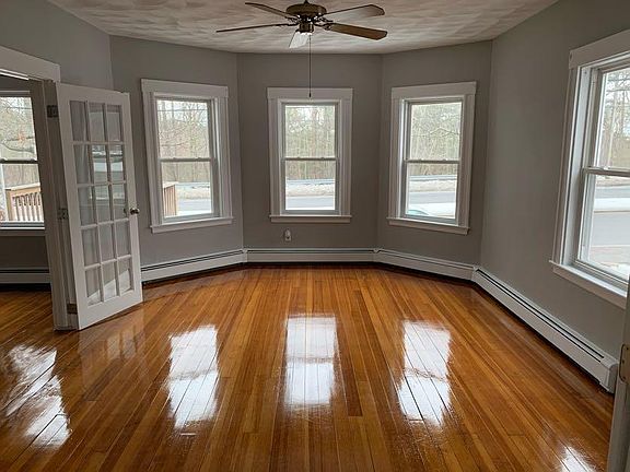 Living room with french doors in both entryways.