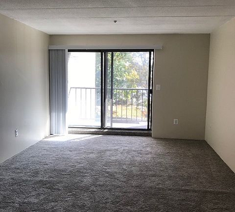 bright livingroom/dining room with slider to private balcony
