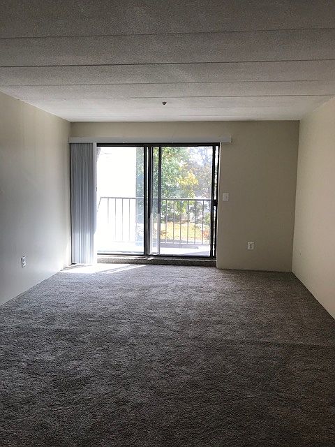 bright livingroom/dining room with slider to private balcony