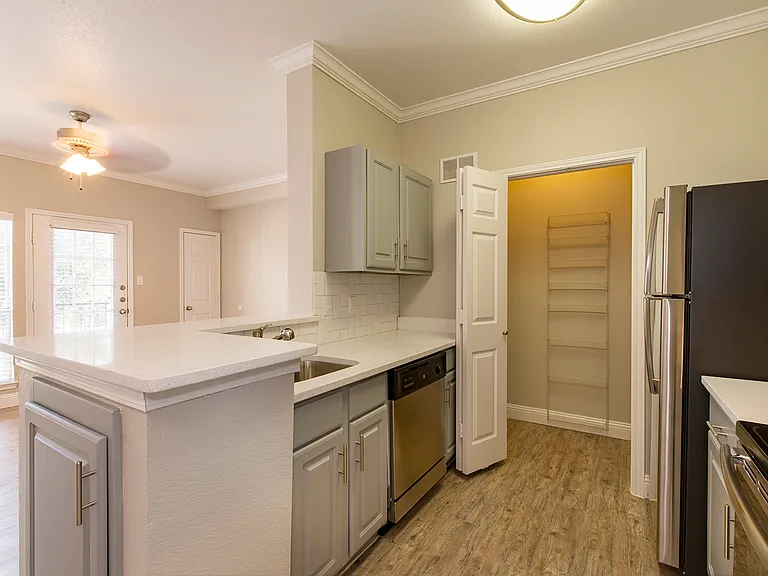 Updated kitchen with stainless-style appliances and ample storage