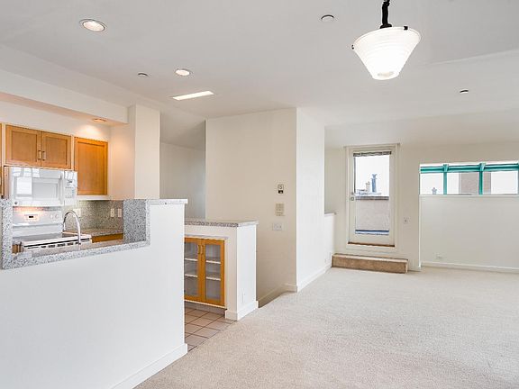 Open kitchen leading to the living room area