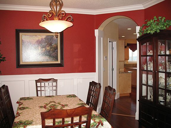 Custom millwork with columns, arches, crown moulding and wainscot!