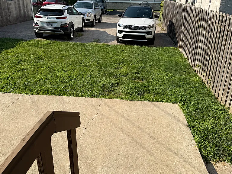 Back patio, yard and 2 parking spots