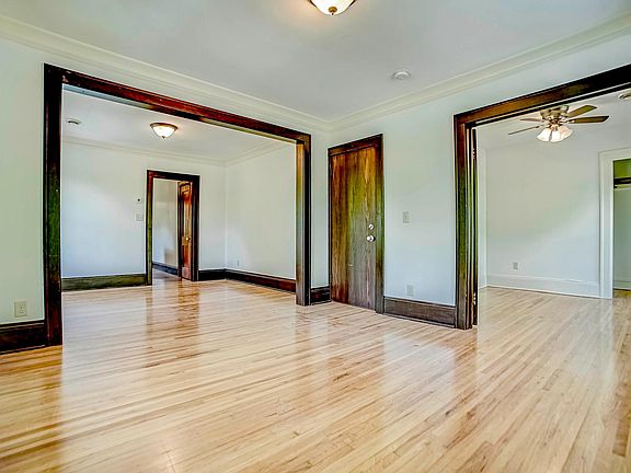 Dining and living rooms, and bedroom (with its French doors open)