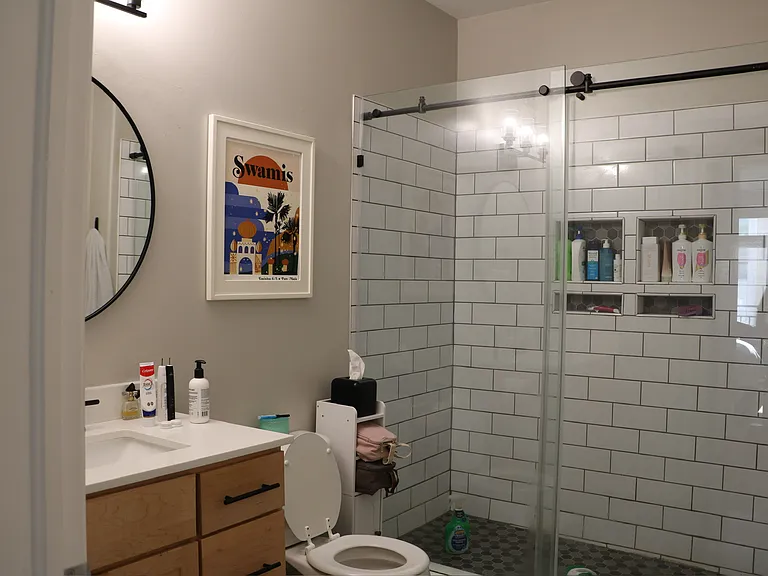 Spa-like ensuite bathroom in the primary bedroom _ sleek modern tile finishes