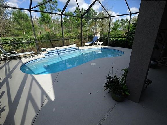 Check out this Beautiful Pool with covered lanai.