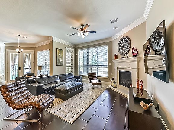 Expansive family room overlooks the luxurious backyard.