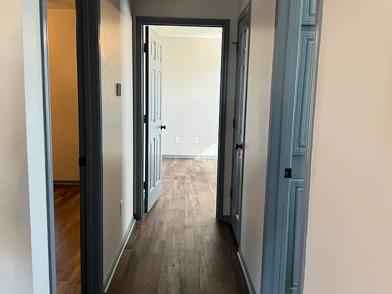 Hallway with master on left, 2nd bedroom at end, hall closet and 2nd bath.