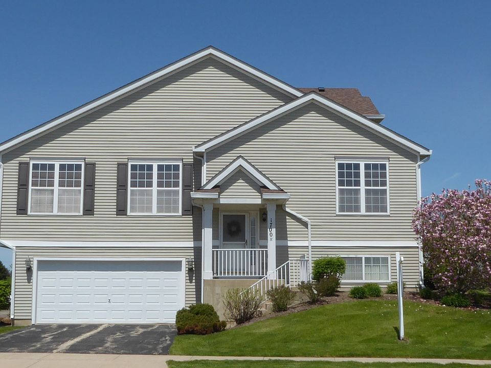Front Facade  Private entrance, garage and driveway access.