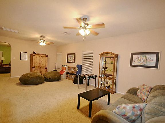 FORMAL LIVING/DINING ROOM COMBO. Family is currently using this area as an additional play area for the children.