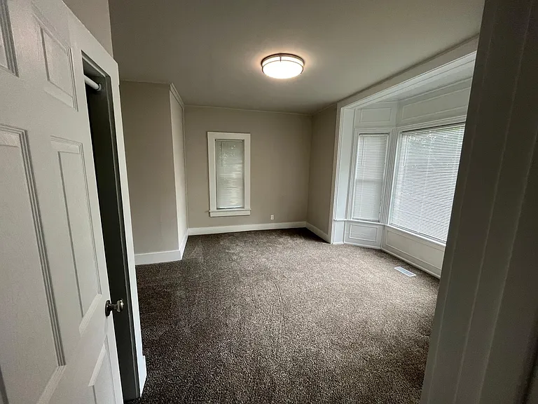 Large bedroom with big windows