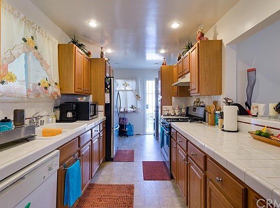 Updated kitchen with direct access to the garage and backyard.