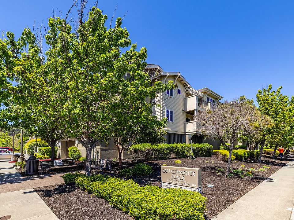 Surrounded by lush landscaping.
