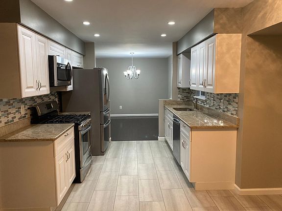 Renovated Kitchen. Window above sink has view of forested area.