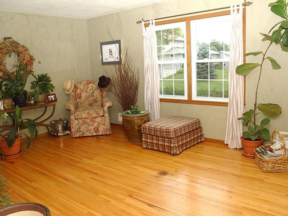 Large and bright living room. Hardwood floors and new windows throughout home