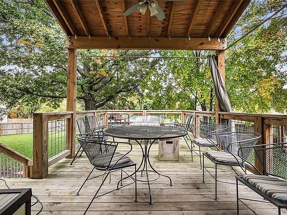 Covered Deck leads to Patio & firepit area. Expansive fenced yard. Wonderful outdoor space to relax, refresh & renew.