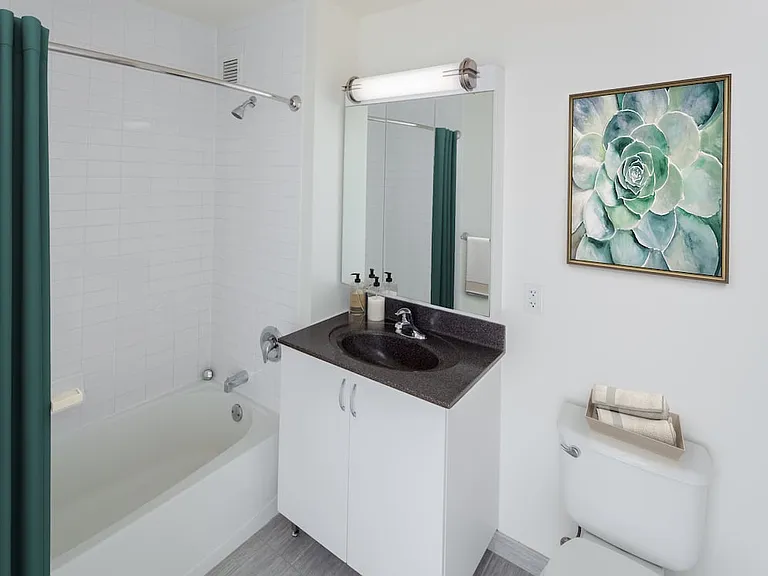 Classic Package I bath with white cabinetry, granite countertops, and hard surface flooring