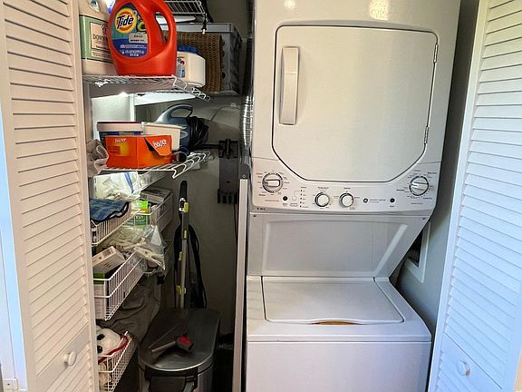 Utility closet with washer and dryer.