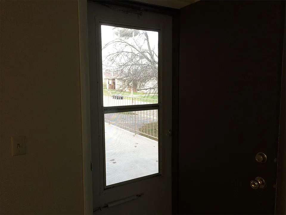 Side door off the living area out to the porch
