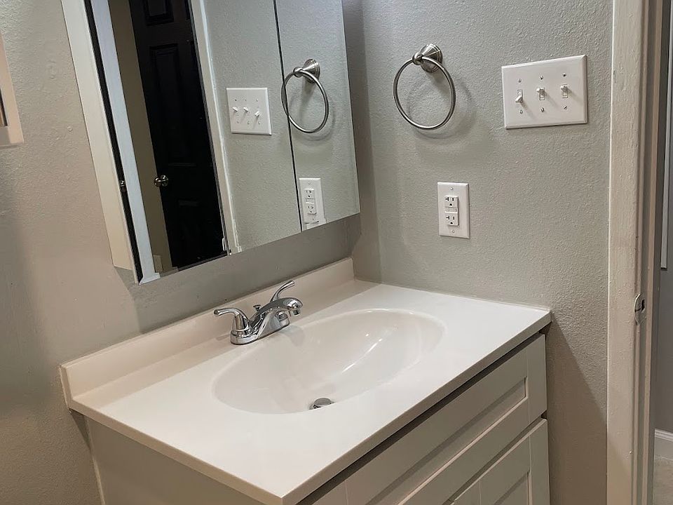 Bathroom has a new wood vanity with slow-close feature on the doors and mirrored medicine cabinet.