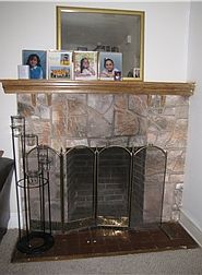 Stone Woodburning Fireplace in Living Room