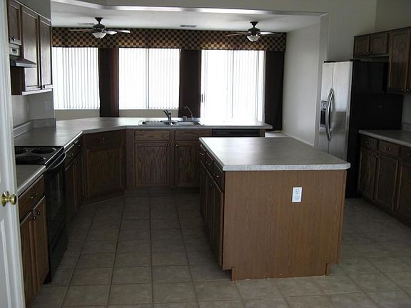 Kitchen features generous counter area, lots of cabinets, stainless appliances