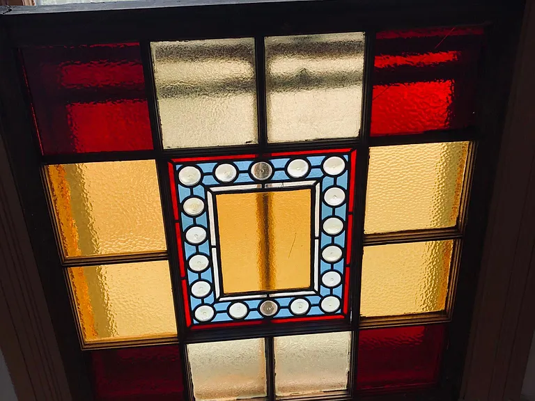 Stained glass window in powder bath. Beautiful light streams through.