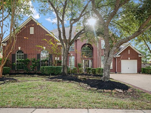 Beautiful established trees frame this beautiful home, nestled in the Manor section, within walking distance to the lake, park & tennis courts & Recreation Center.