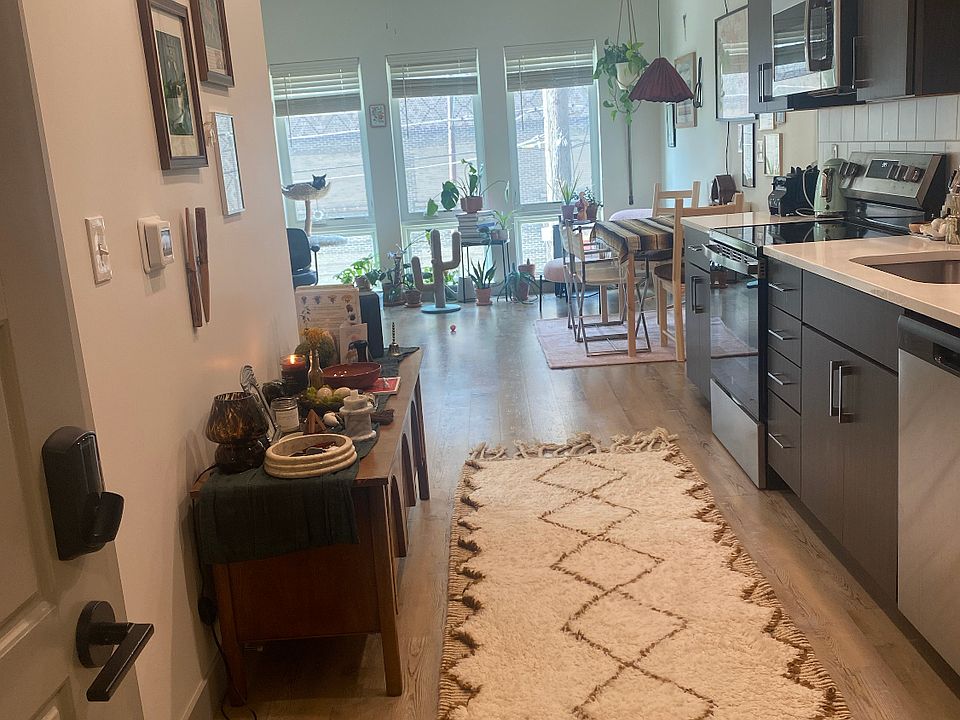 Foyer (entryway) and kitchen. The laundry is located in the closet to the left, and the pantry is to the right.