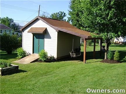 Large custom built shed with porch area.