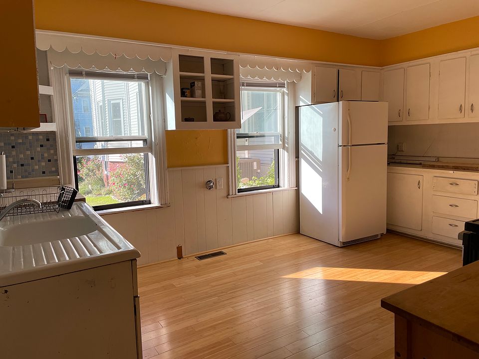 Eat-in-kitchen with view of neighbors' yard