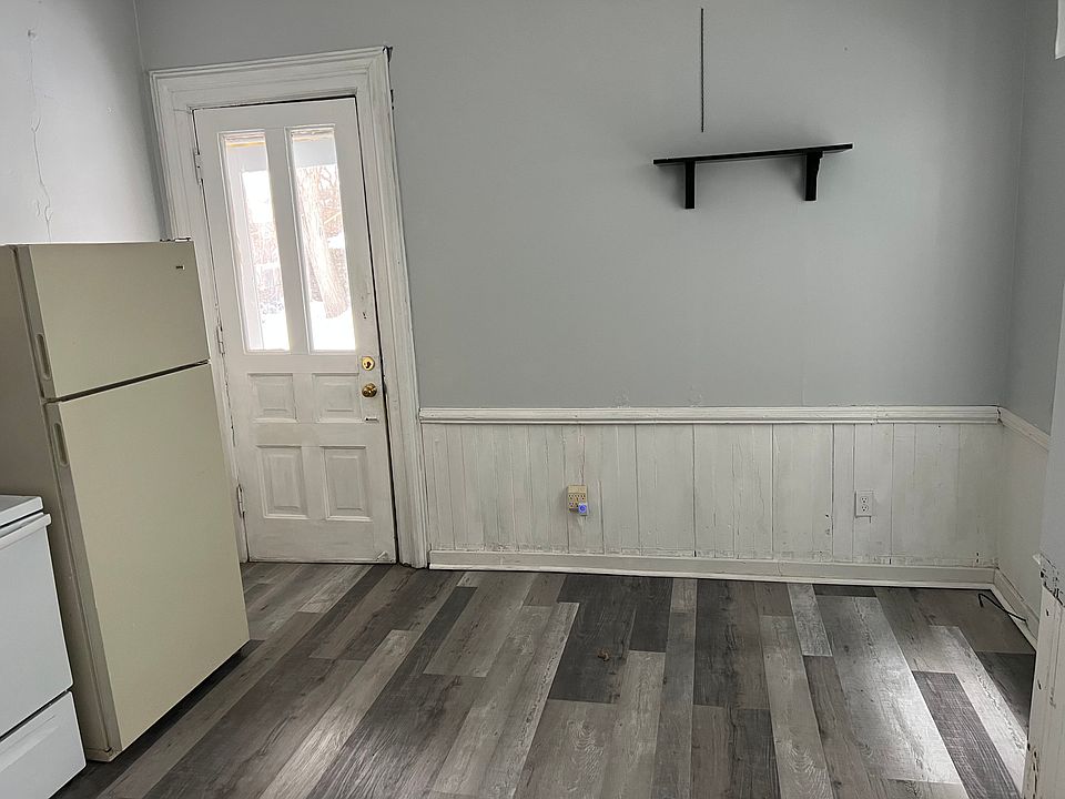 Backdoor from kitchen leads out to fenced in yard.