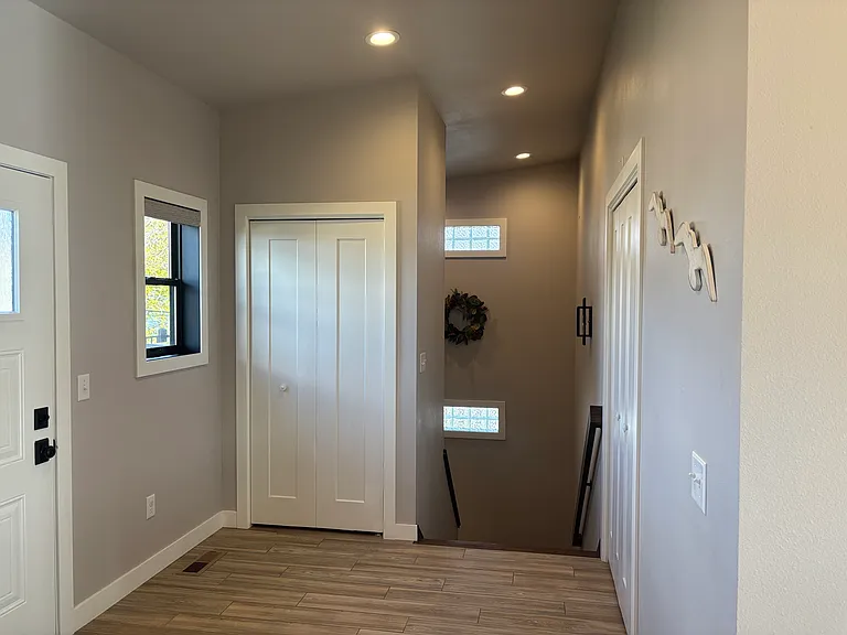 entry from kitchen going into stairwell to garage level