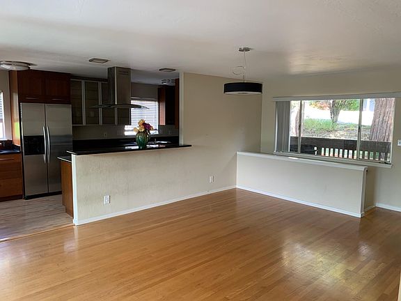 Kitchen opens to large dining area. Previous tenant had a dining table that extended to serve 17 guests.