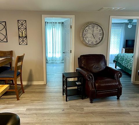 View of entrance to both bedrooms. They both have window AC units