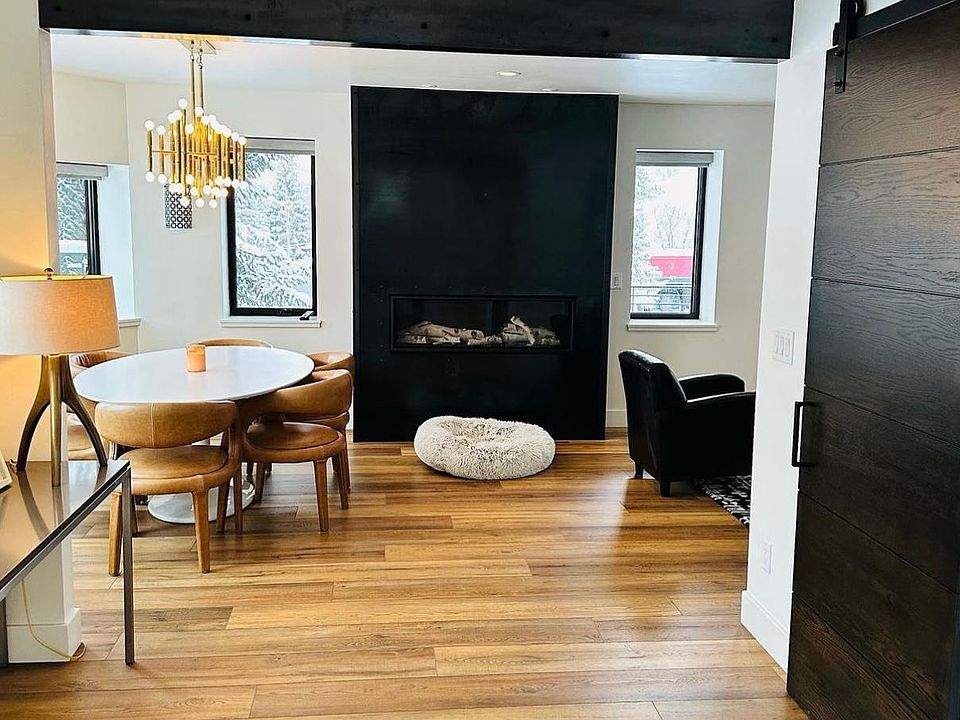 Steel beams and modern steel fireplace. Large mud room.