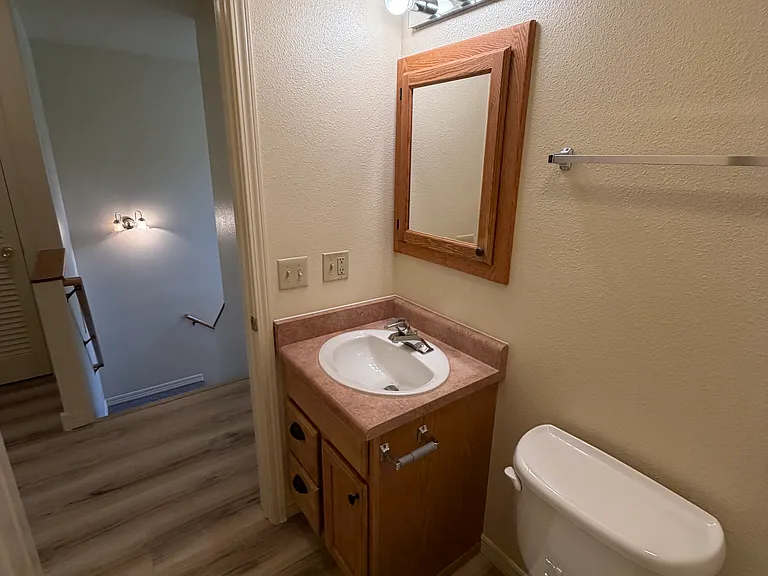 Main bathroom with curved shower curtain rod for more elbow room.