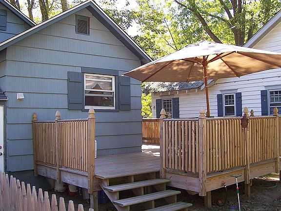 Deck off side and back of home.