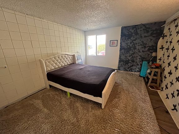 Large bedroom with a walk in closet