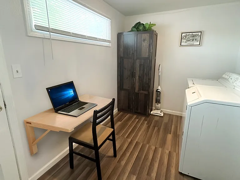 In-house washer and dryer, and work area.