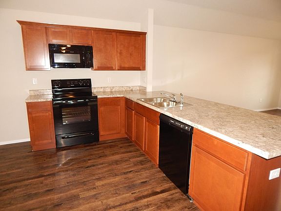 You'll love this huge breakfast bar! Refrigerator furnished. Even has a pantry and room for your table!