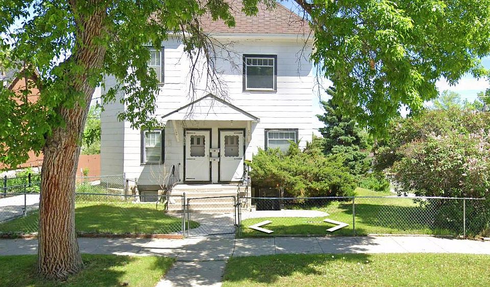 Streetside view from 5th Avenue. Left door leads to this second-floor apartment. Right door leads to neighbors in ground floor apartment. Yard is shared.