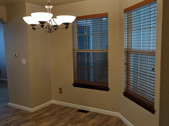 Large kitchen with window has plenty of space and the hangin