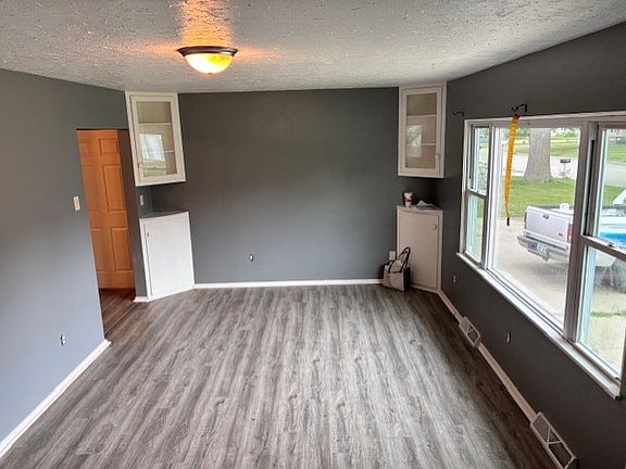 Living room with BRAND NEW LVT wood plank flooring.