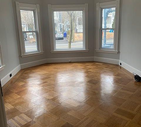 Large bright front room...again there are may options. Many 1920's touches...pocket door between.