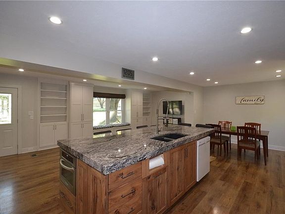 Huge center island with large double sink and room for 6 bar stools comfortably!