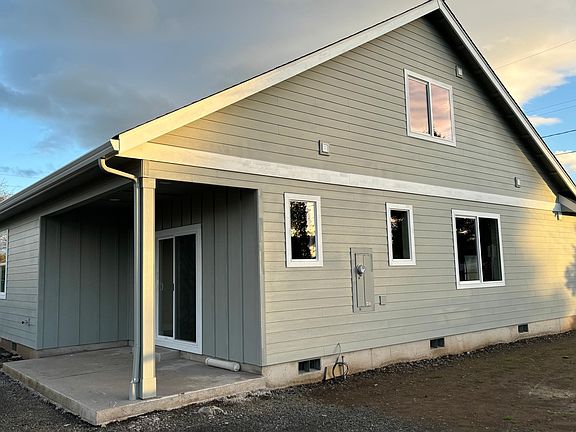 Back covered patio with slider from living room. Fence and yard will be installed by mid January.