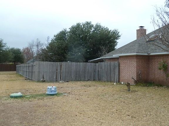 ALMOST AN ACRE YARD.