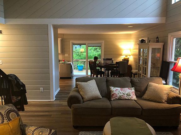 Living room view to back door and deck