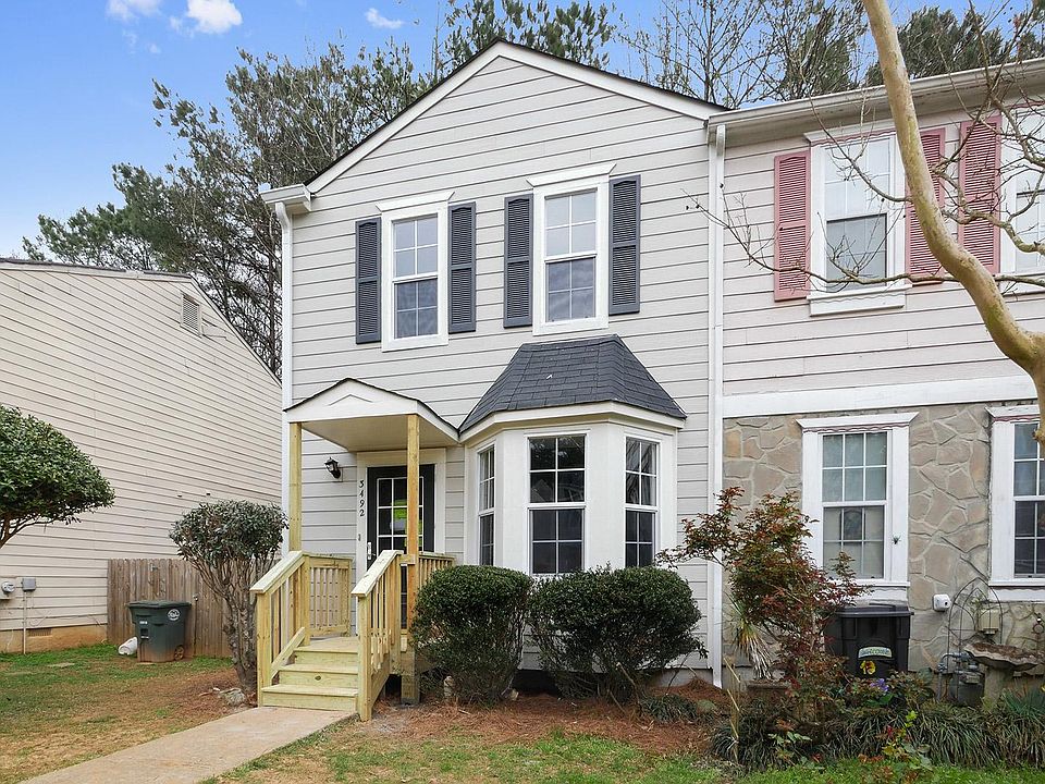 End unit, fenced in back yard, new front porch and back deck